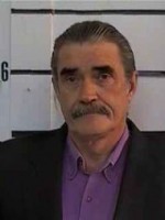 Johnny McPhail Older man with salt-and-pepper hair and mustache